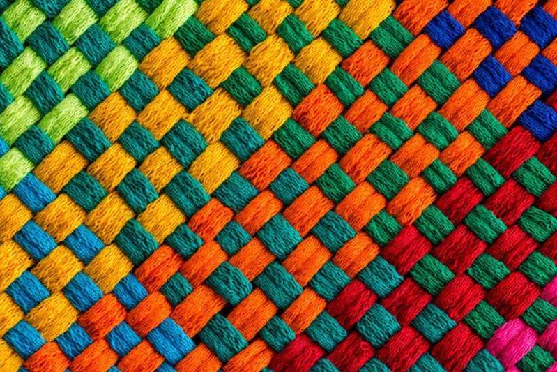 Different colour threads woven together