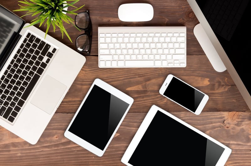 Mac computers and devices on a table