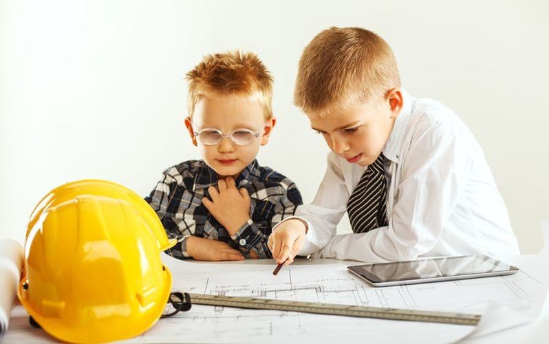 Two children dressed as engineers