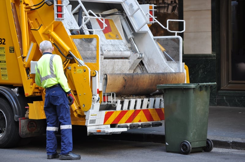 Bin man and garbage truck