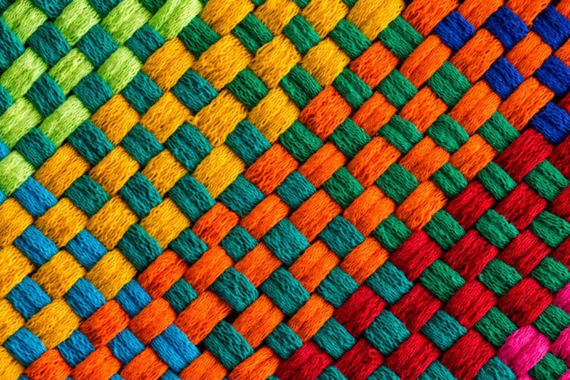 Different colour threads woven together