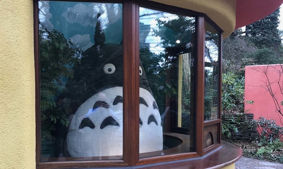 Totoro behind a ticket counter at the Studio Ghibli museum