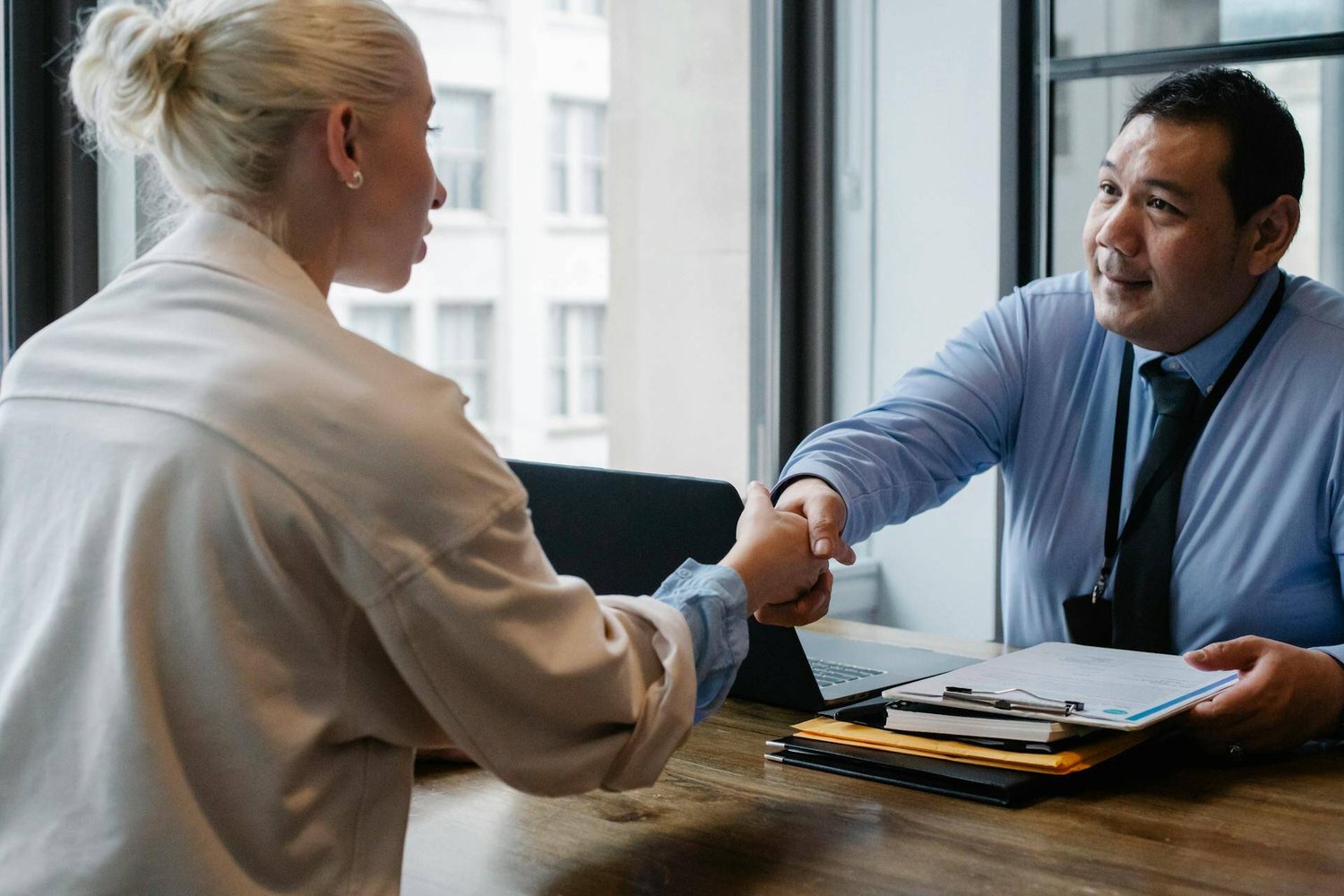 Two people handshaking in agreement